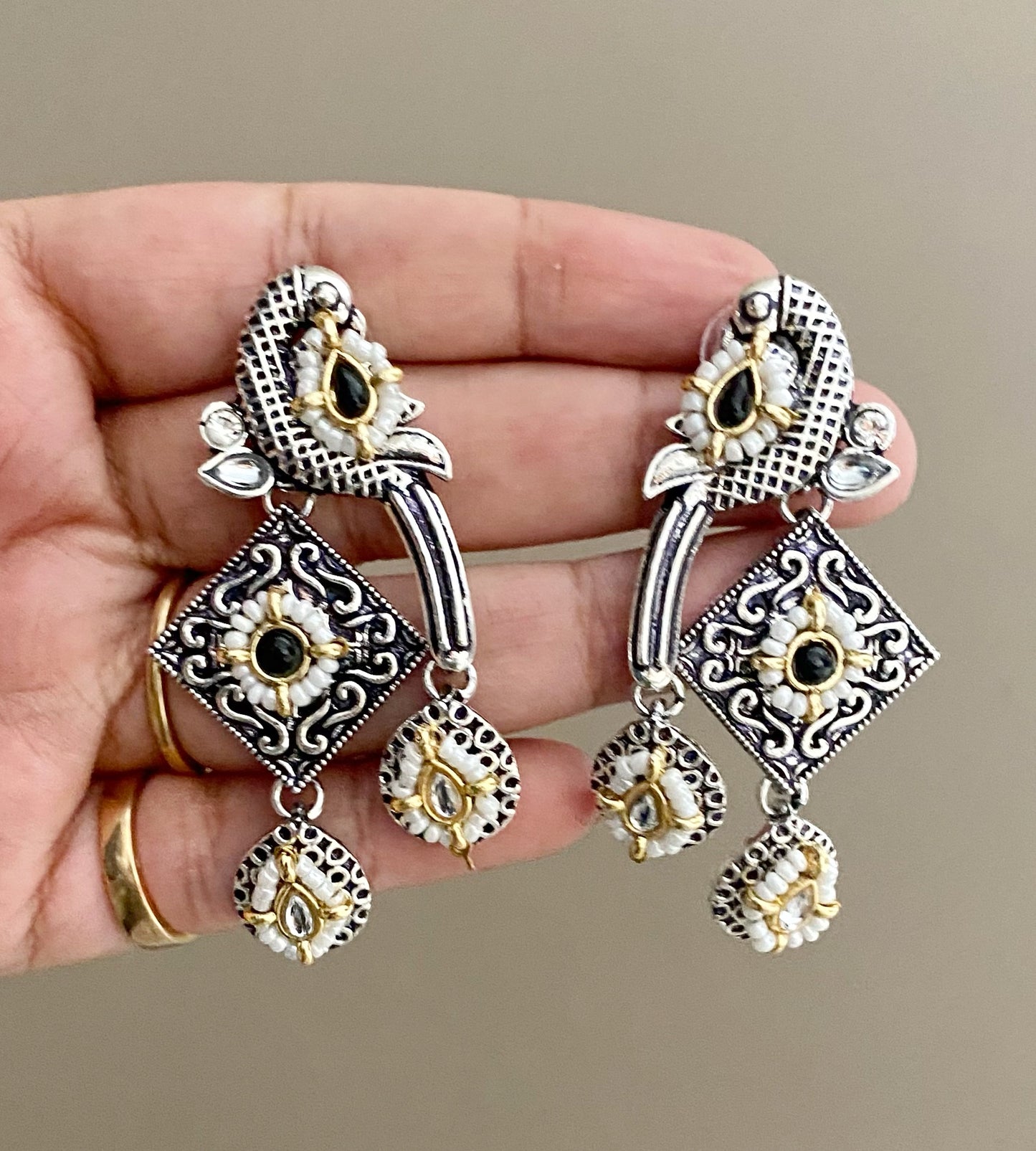 Black bani peacock earrings