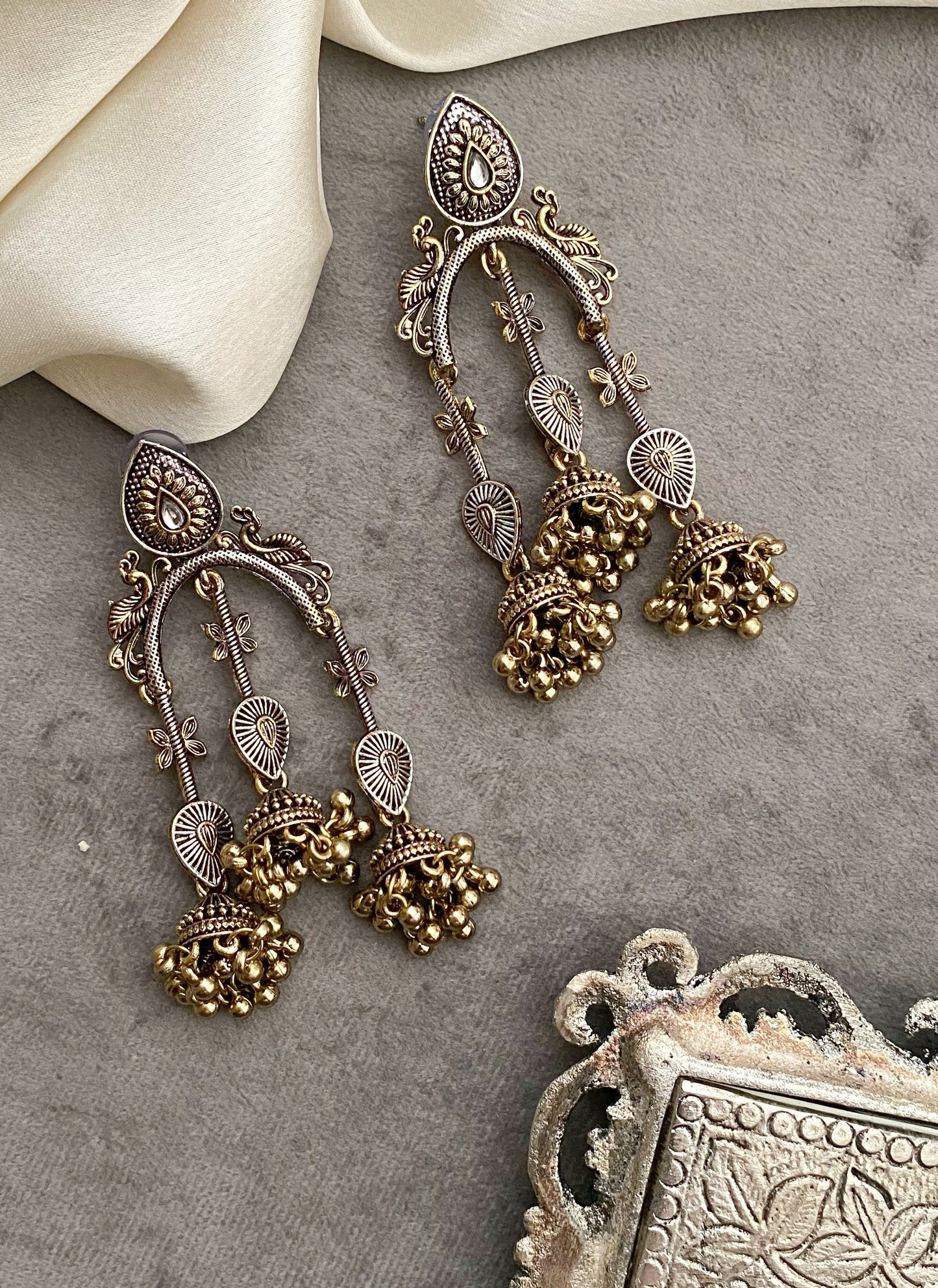 Taruni dual tone kundan earrings