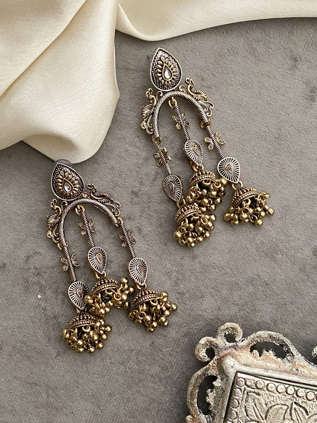 Taruni dual tone kundan earrings