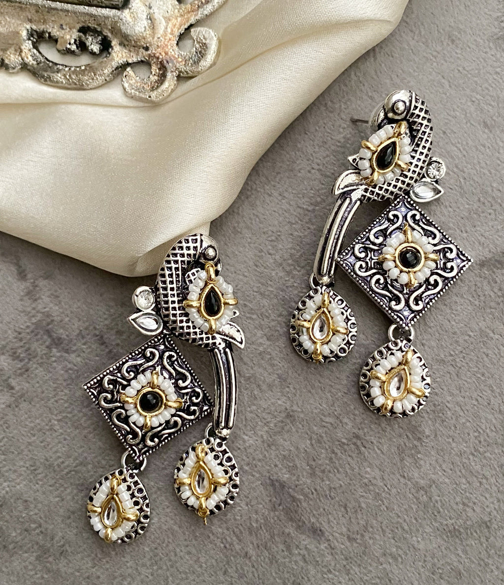 Black bani peacock earrings