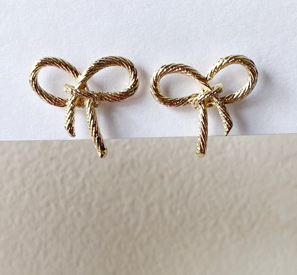 Golden bow studs